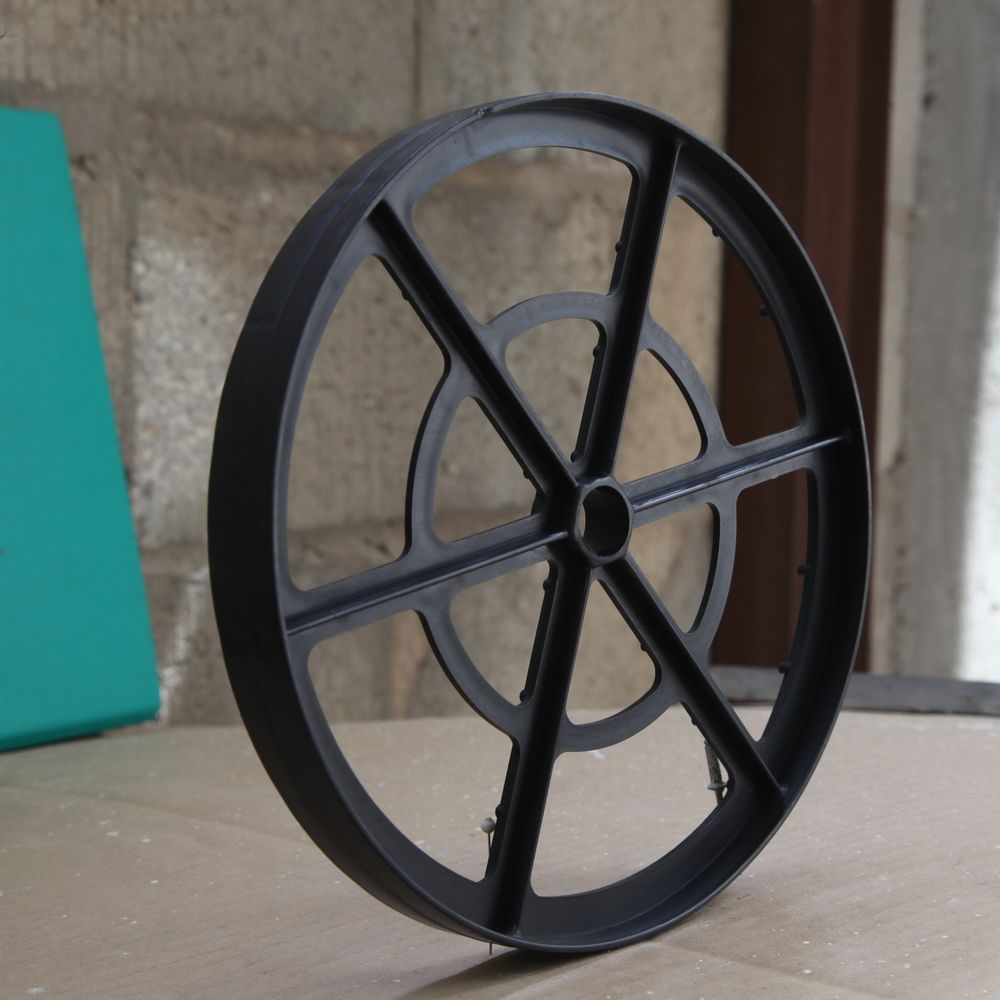 Large-diameter black wheel spacer with six moulded spokes